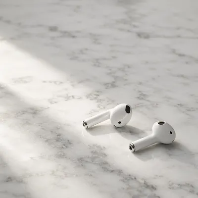 Minimal Wireless Earbuds on White Marble