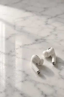Minimal Wireless Earbuds on White Marble