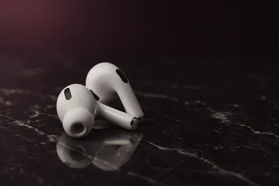 Minimal Wireless Earbuds on Dark Marble