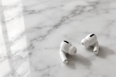 Minimal Wireless Earbuds on White Marble
