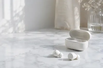 Minimal Wireless Earbuds on Marble Surface