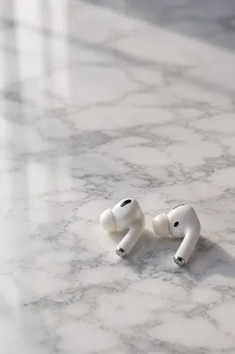 Minimal Wireless Earbuds on White Marble