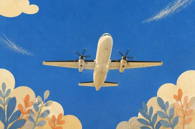 White Airplane Flying Through Clear Blue Sky