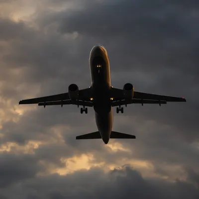 Passenger Airplane Climbing Through Storm Clouds