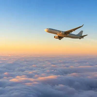 Passenger Airplane Above Sunrise Cloudscape