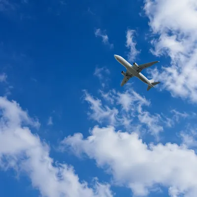 Passenger Airplane Crossing Blue Sky