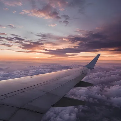 Peaceful Airplane Wing Above Twilight Clouds