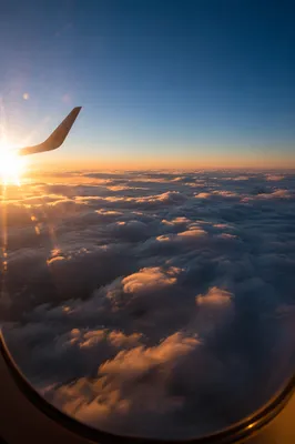 Golden Hour Flight Above Soft Clouds