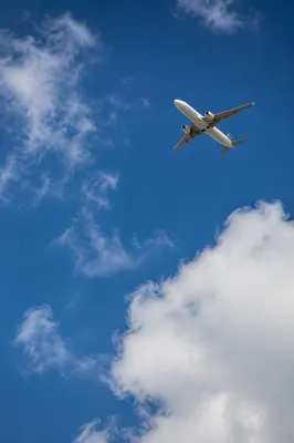 Passenger Airplane Over Blue Sky Clouds