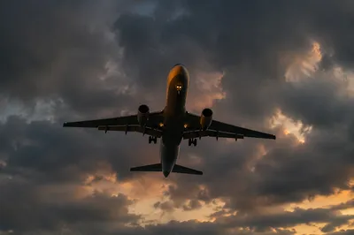 Airplane Climbing Through Dramatic Storm Clouds
