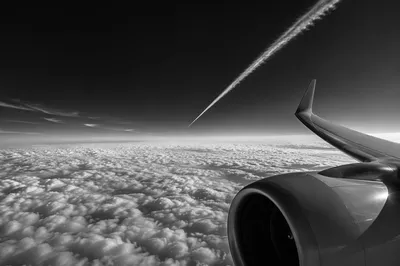 Monochrome Airplane Window View Above Clouds