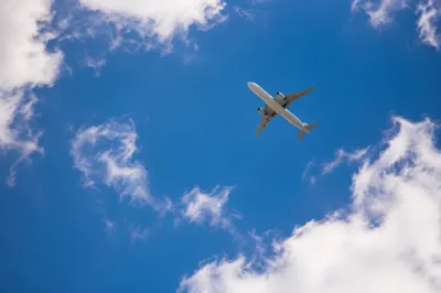 Passenger Airplane Over Deep Blue Sky