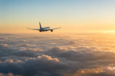 Airplane Above Morning Clouds