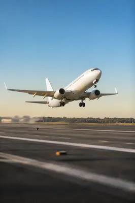 Passenger Airplane Taking Off Under Blue Sky