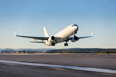 Passenger Airplane Taking Off Under Blue Sky