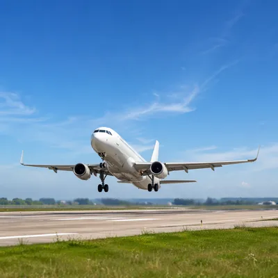 Passenger Airplane Taking Off Under Blue Sky