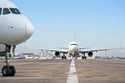 Commercial Airliner Taking Off Under Blue Sky