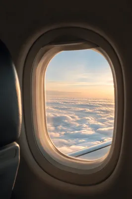 Serene Airplane Window Above the Clouds