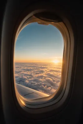 Sunrise Clouds Through Airplane Window