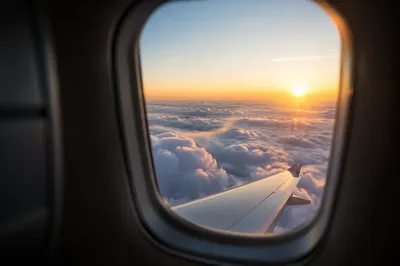 Sunrise Clouds Through Airplane Window