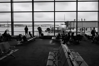 Quiet Airport Departure Gate With Travelers