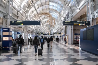 Modern Airport Departure Concourse with Travelers