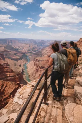Backpack Hikers Overlooking Desert Mountain Canyon