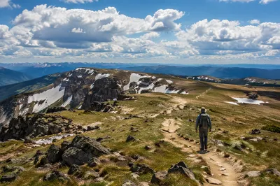 Lone Backpacker on Mountain Plateau Trail