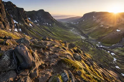 Backpack on Mountain Trail at Sunrise