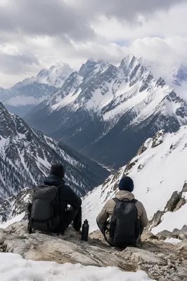 Hikers Resting on Snowy Mountain Trail