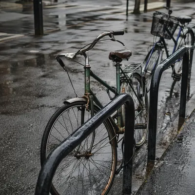 Rainy Urban Commute With Weathered Green Bicycle