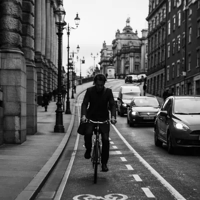 Monochrome Urban Bicycle Commute on City Street