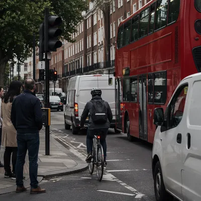 Urban Bicycle Commute Through Busy City Street