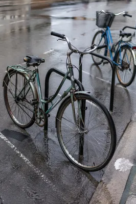 Rainy Urban Commute With Weathered Green Bicycle