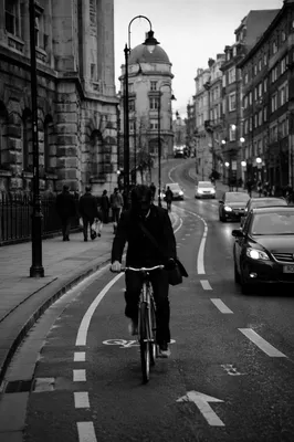 Monochrome Urban Bicycle Commute on City Street