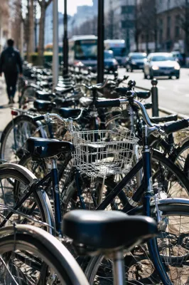 Crowded Commuter Bicycles on Urban Sidewalk