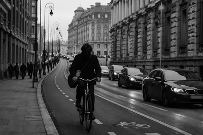 Monochrome Urban Bicycle Commute on Curved Street