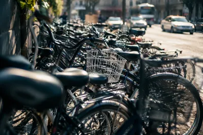 Crowded Commuter Bicycles on Urban Sidewalk