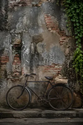 Vintage Bicycle by Weathered Urban Brick Wall