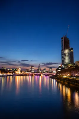 Illuminated Bridge Over River at Blue Hour