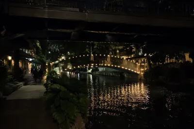 Night Bridge Lights Over Quiet Riverwalk