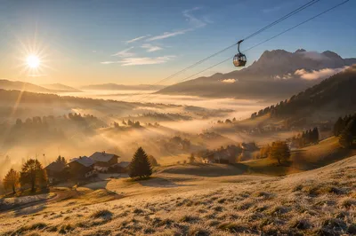 Misty Sunrise Cable Car Over Alpine Ridge