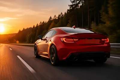 Red Sports Coupe at Sunset Highway