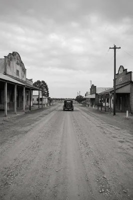 Vintage Car on Dusty Rural Highway
