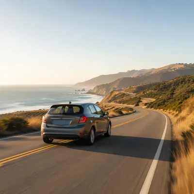 Compact Car on Scenic Coastal Highway