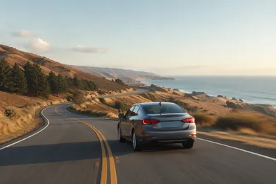 Compact Car on Scenic Coastal Highway