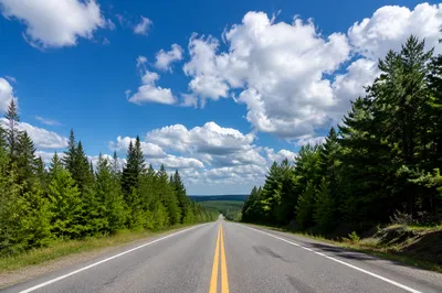 Scenic Rural Highway Under Hopeful Blue Sky
