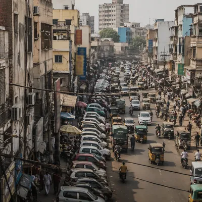 Busy Urban Street with Parked Cars