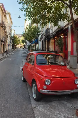Red Classic Vintage Car on Quiet Road