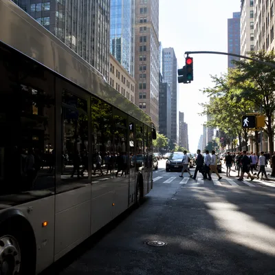 Busy Downtown Crosswalk With City Bus